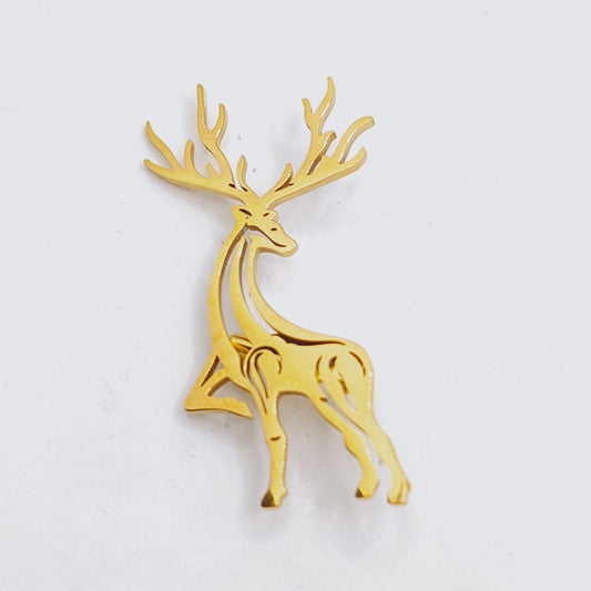 Gold deer-shaped object on a light gray background