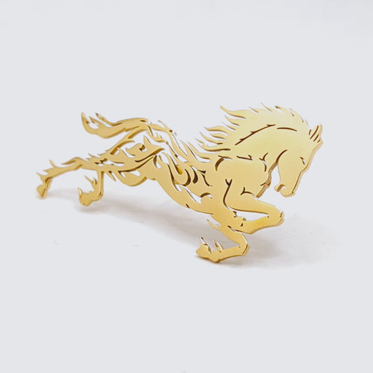 Gold horse-shaped emblem on a white background