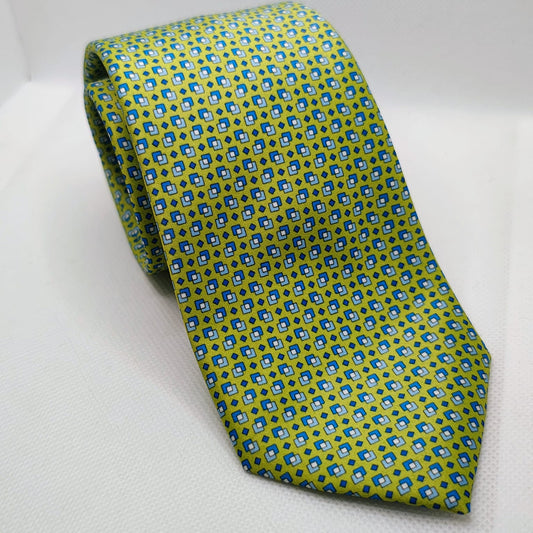 Green patterned tie on a white background