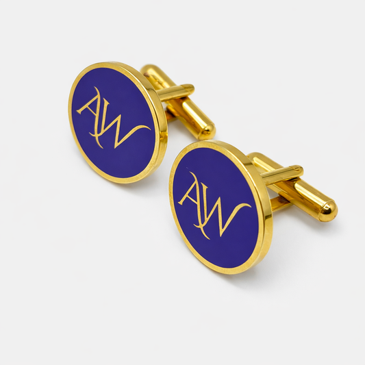 Gold cufflinks with blue circular design featuring 'AW' on a white background