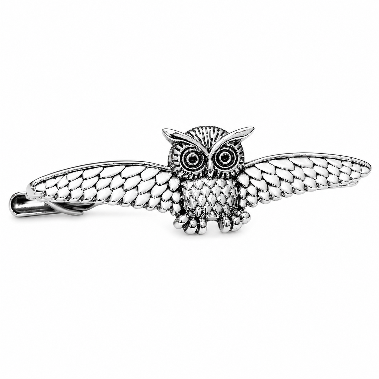 Silver owl tie clip a white background
