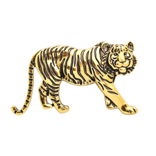 Gold tiger figurine on a white background