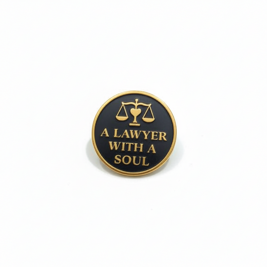 Pin with 'A Lawyer with a Soul' text and scale design on a white background