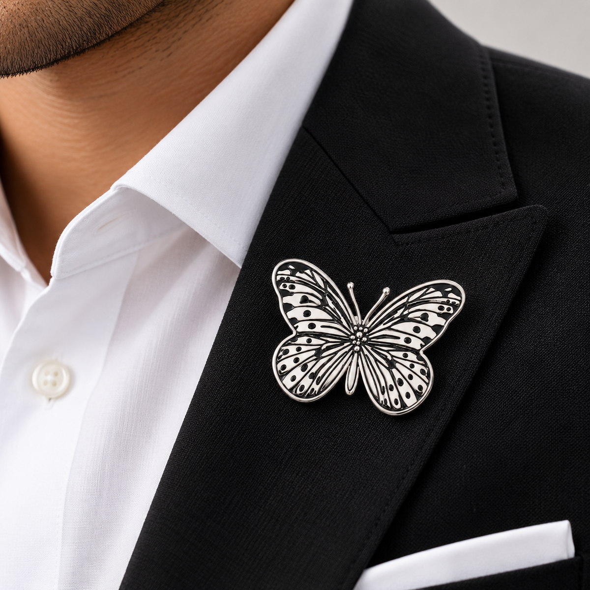 Albetro The Monarch Noir silver butterfly brooch on black suit lapel