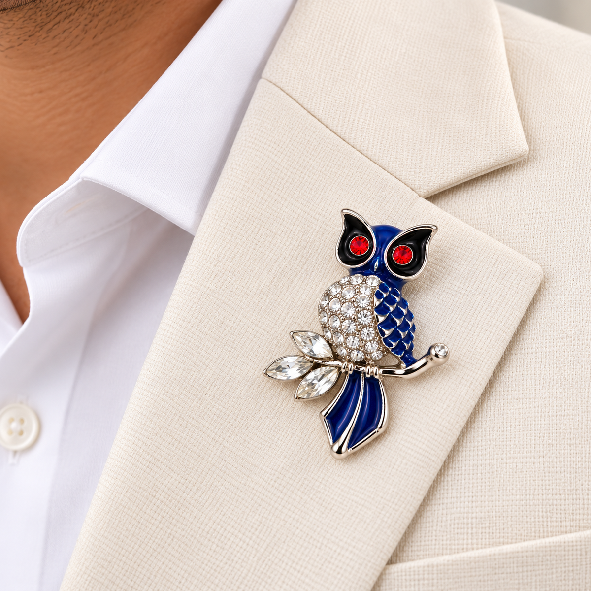 Albetro The Sapphire Sentinel blue crystal owl brooch on cream blazer