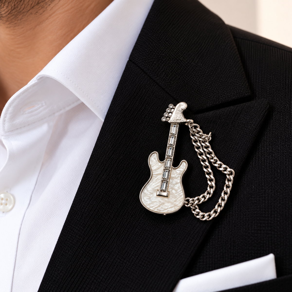 Albetro The Rockstar Blanc pearl guitar chain brooch on black suit lapel