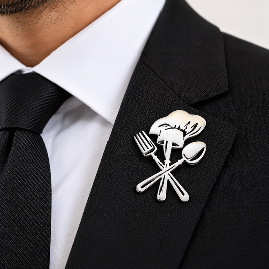 Albetro Le Chef silver culinary brooch with chef hat on black suit lapel