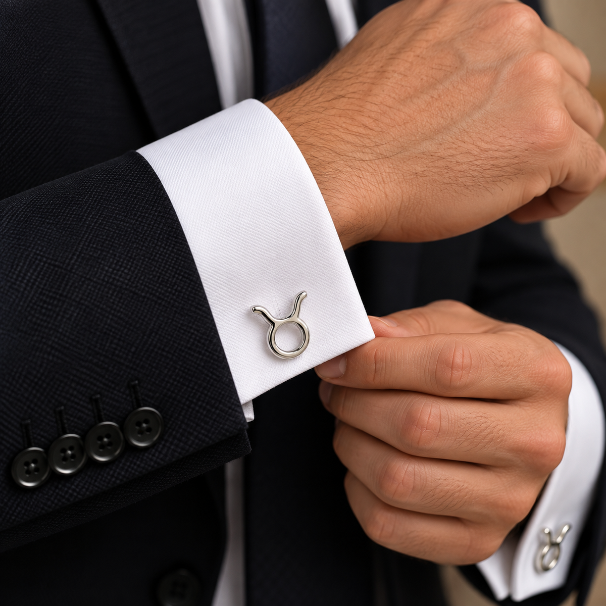 Albetro Taurus zodiac silver cufflink worn on white French cuff shirt