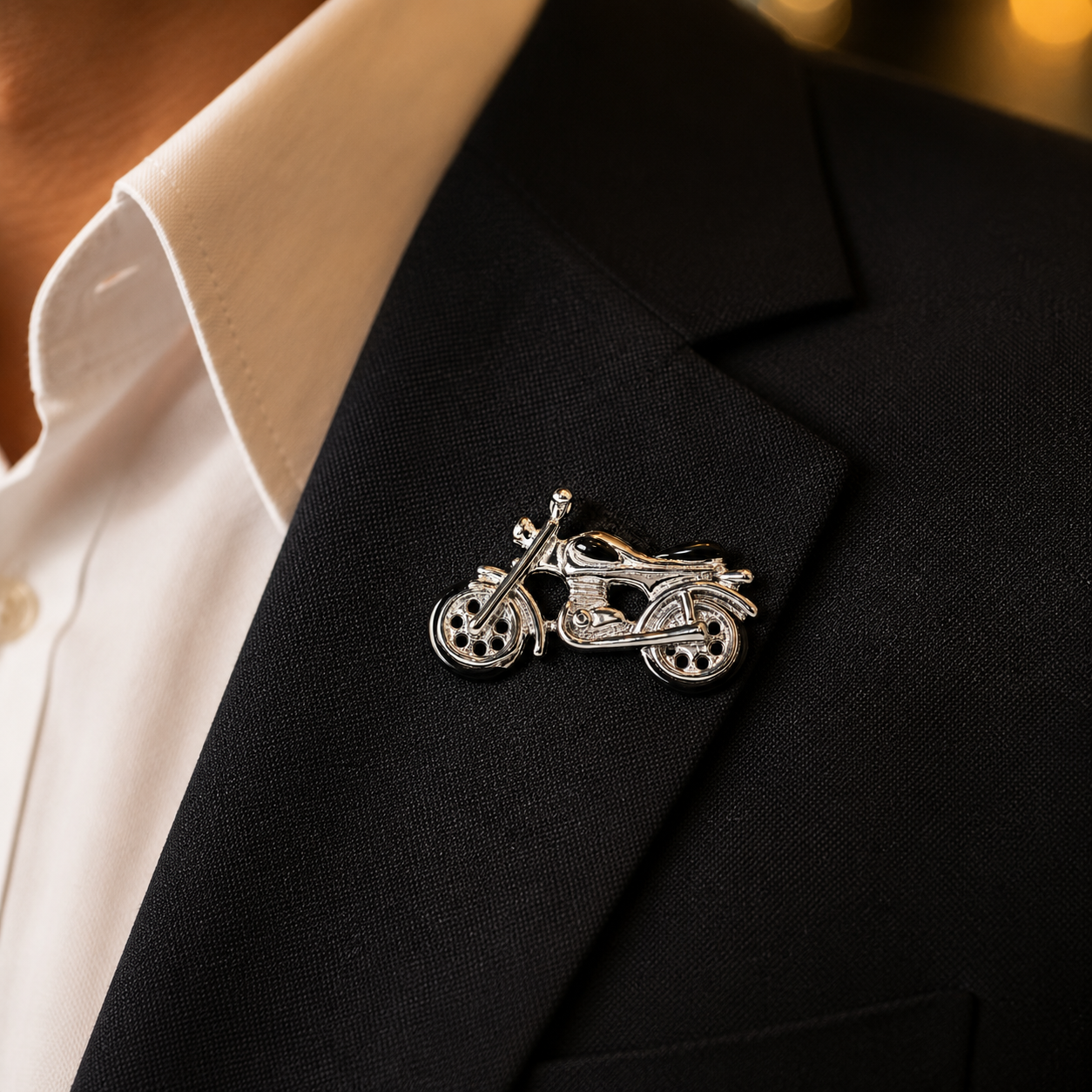 The Veloce Moto Lapel Pin by Albetro worn on black suit lapel