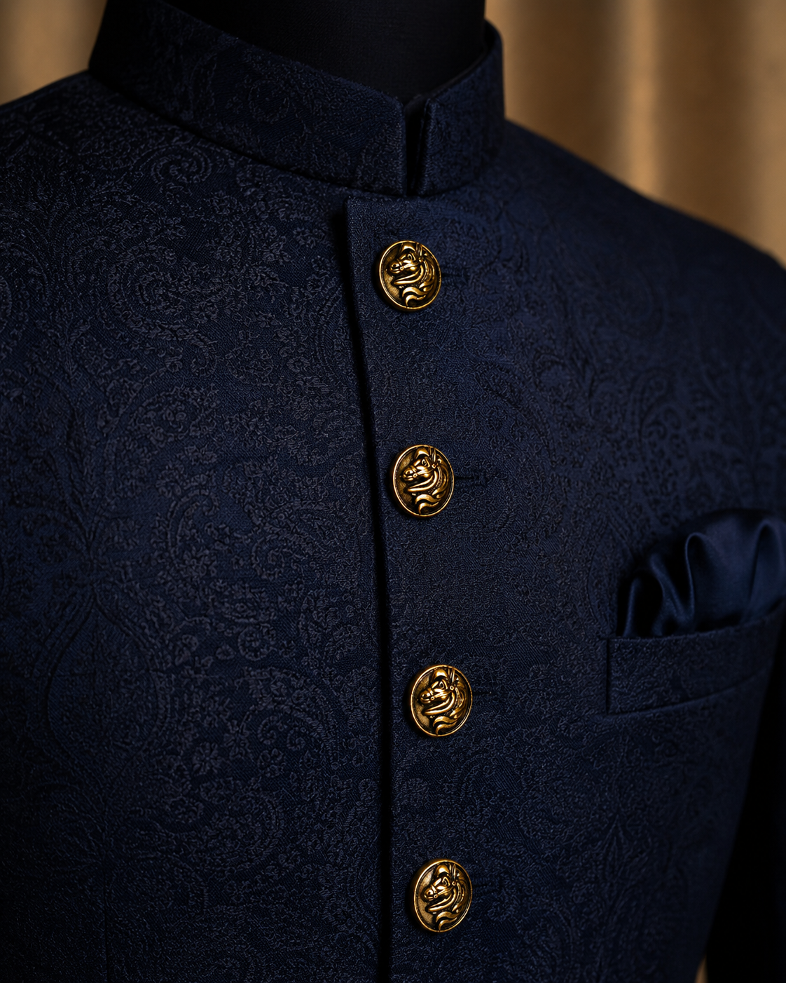 Navy blue jacket with gold buttons on a mannequin against a beige background