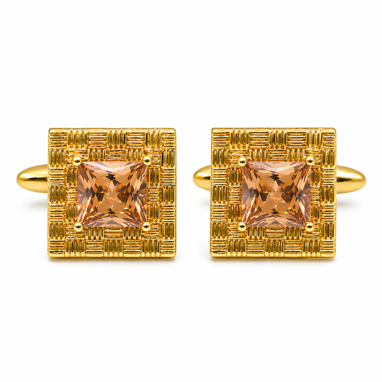 Gold cufflinks with square gemstones on a white background
