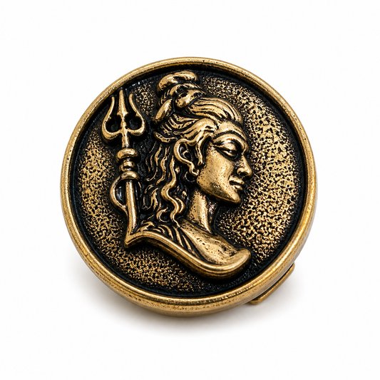 Bronze medallion with a face and trident on a white background