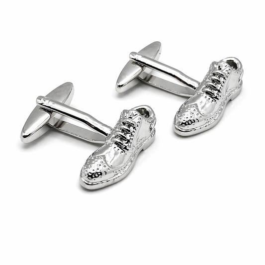 Silver shoe-shaped cufflinks on a white background