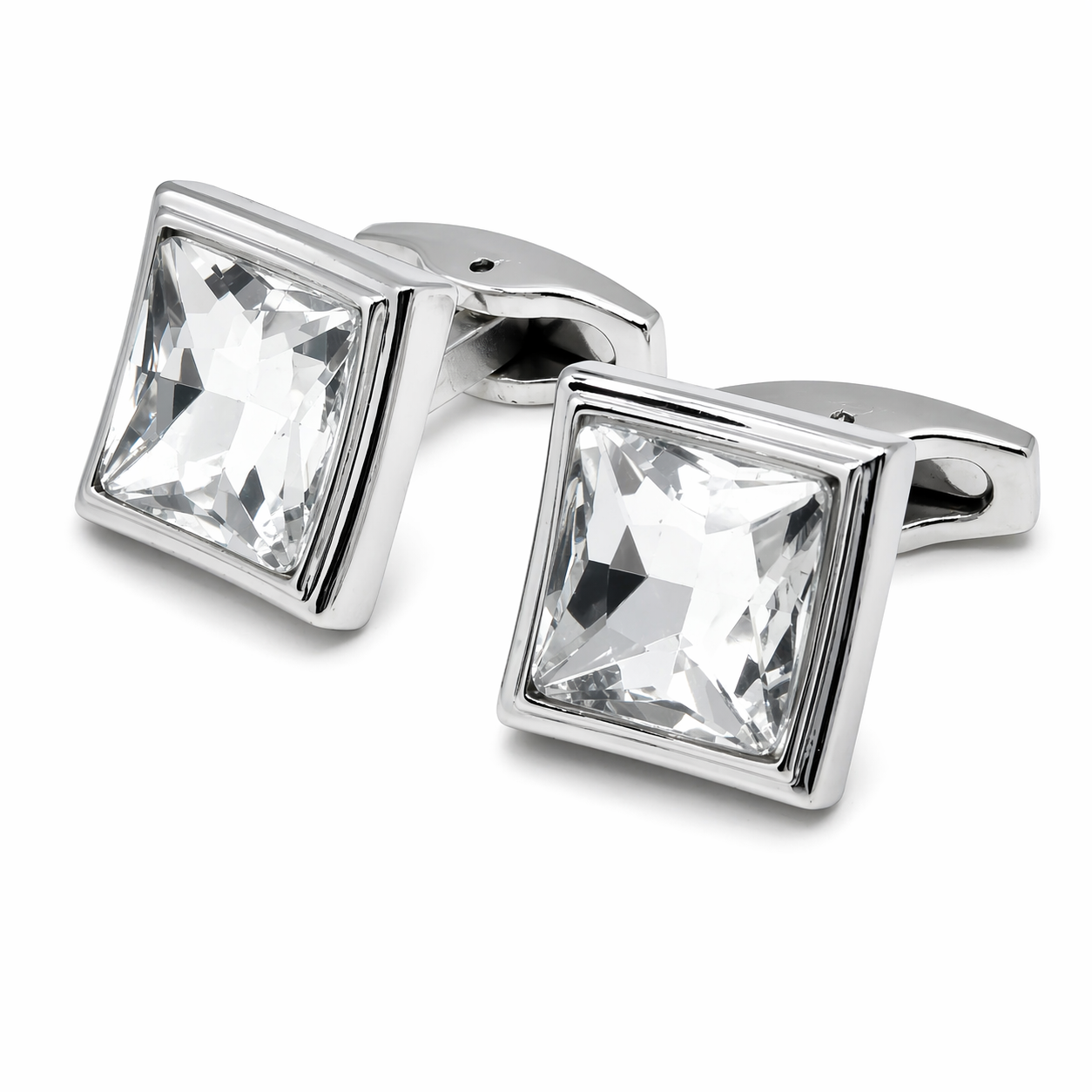 Silver cufflinks with square crystal stones on a white background