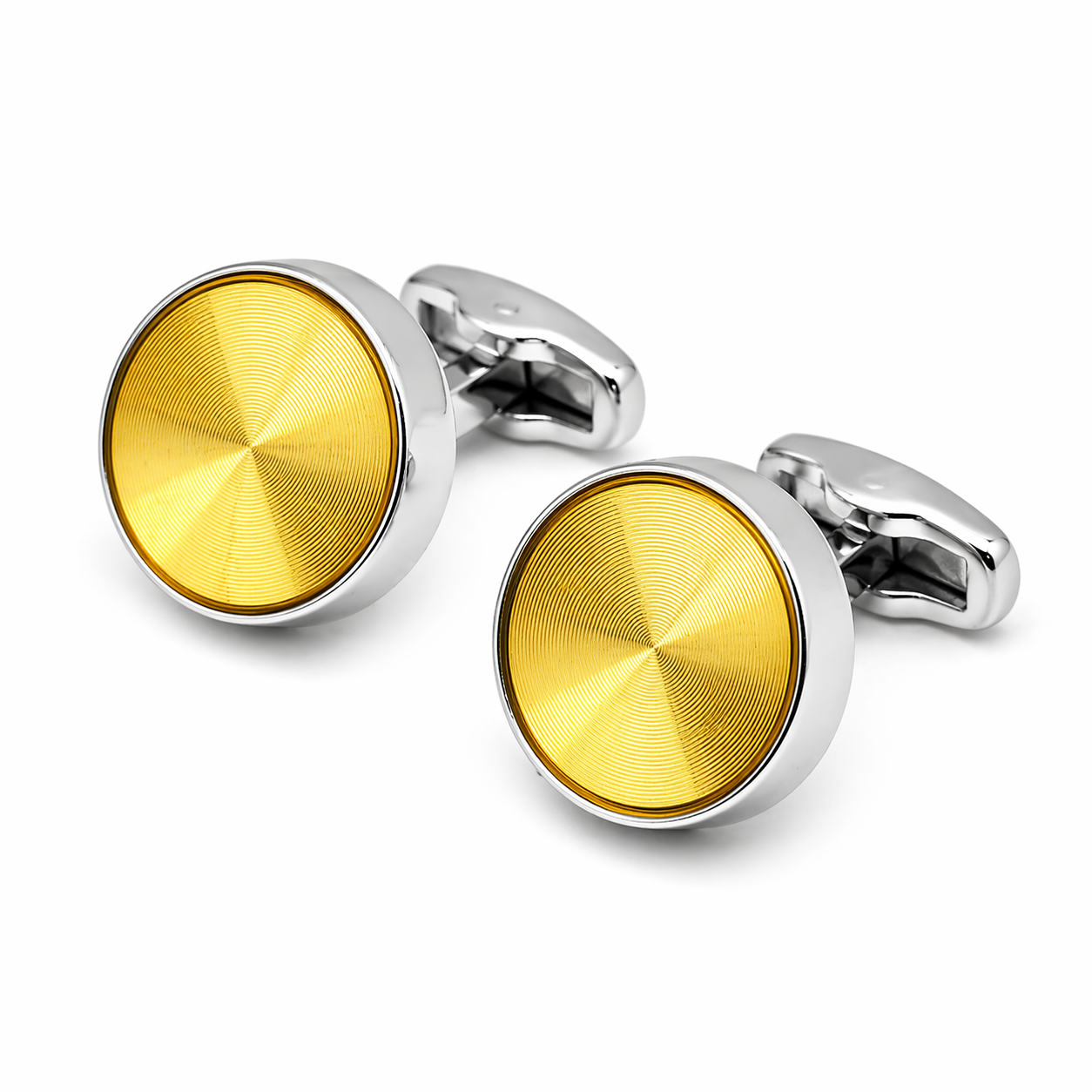 Gold and silver cufflinks on a white background