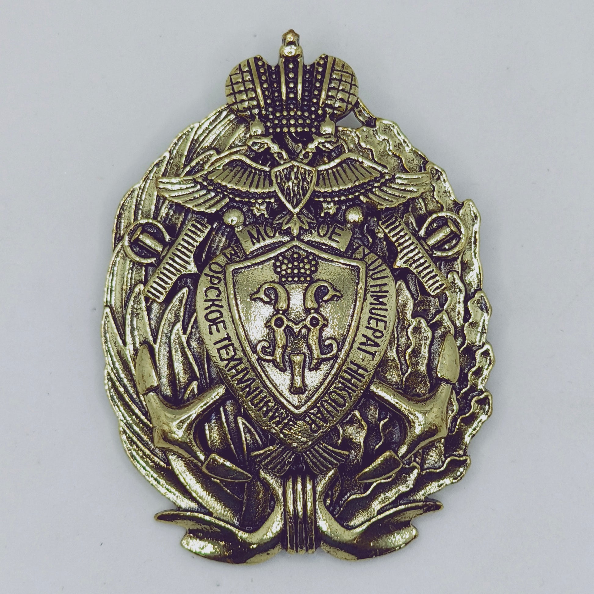 Bronze military badge with intricate