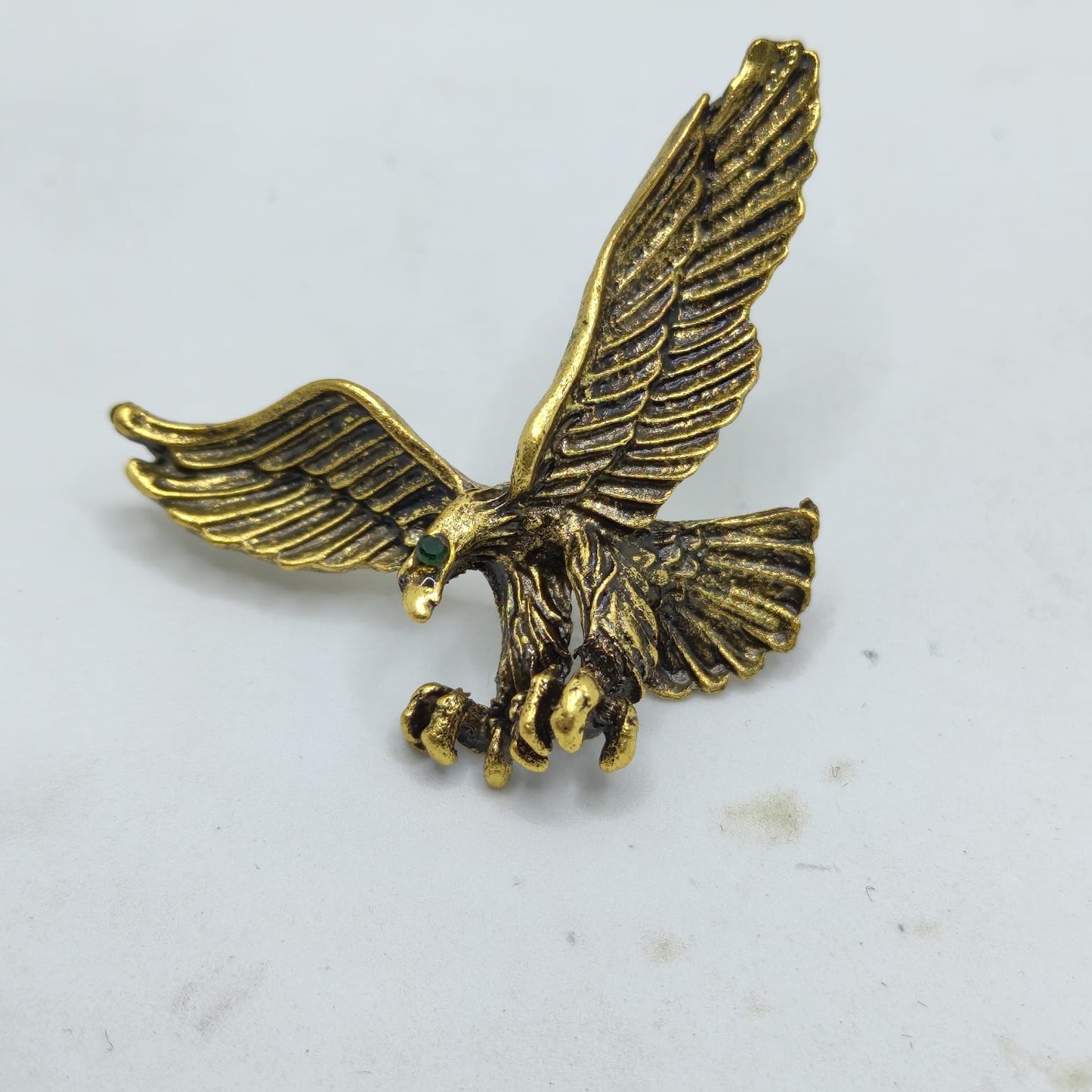 Gold eagle emblem on a white background