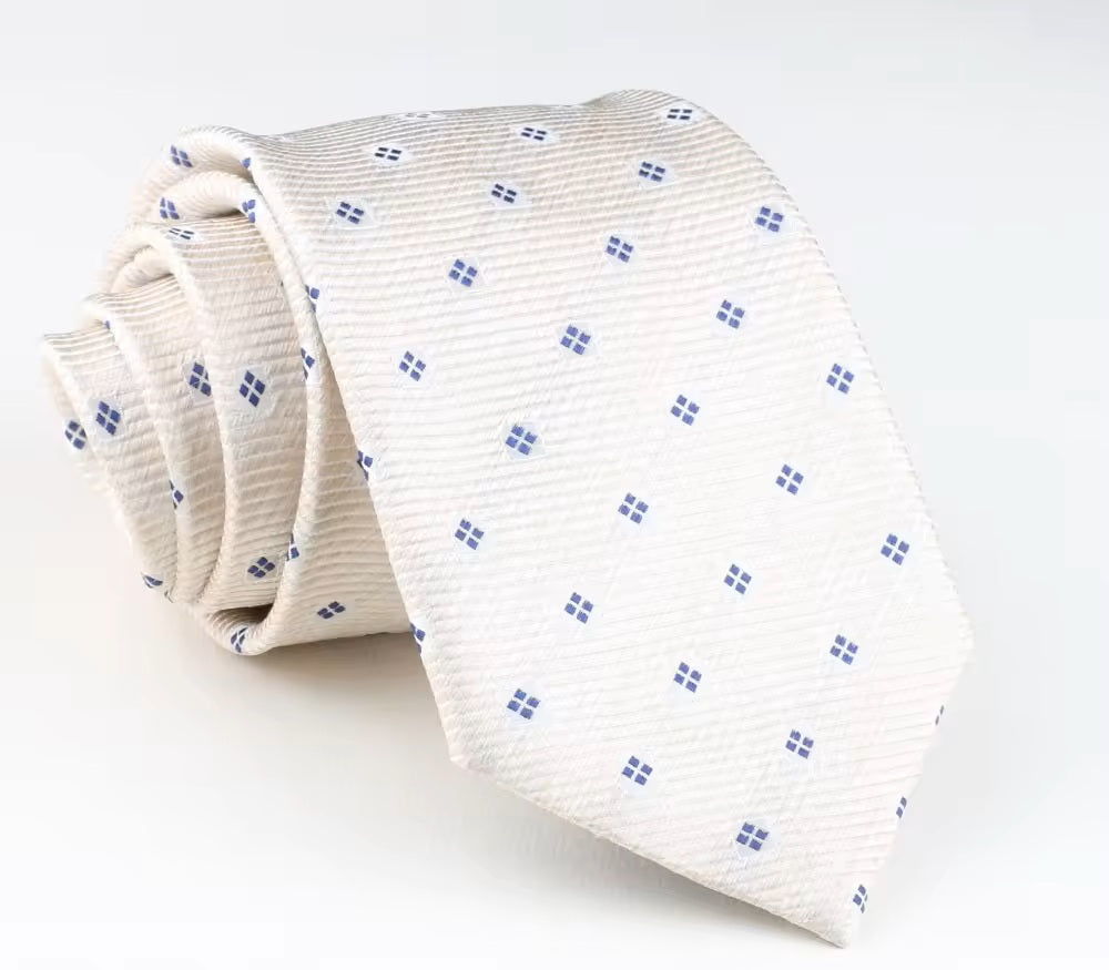 Folded white tie with blue pattern on a light gray background