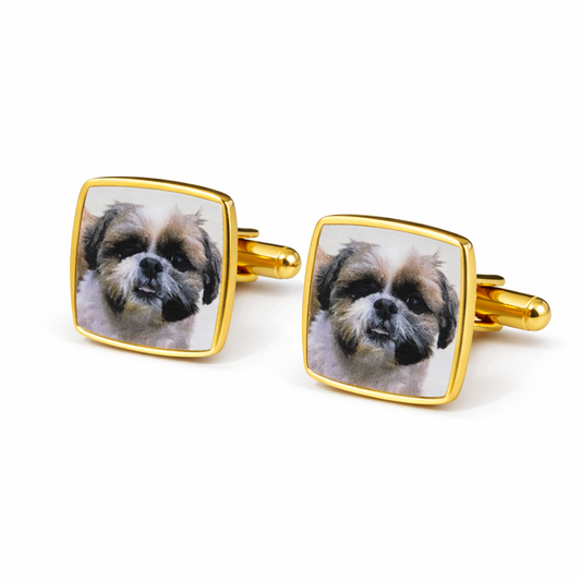Gold square cufflinks with a dog's face on a white background
