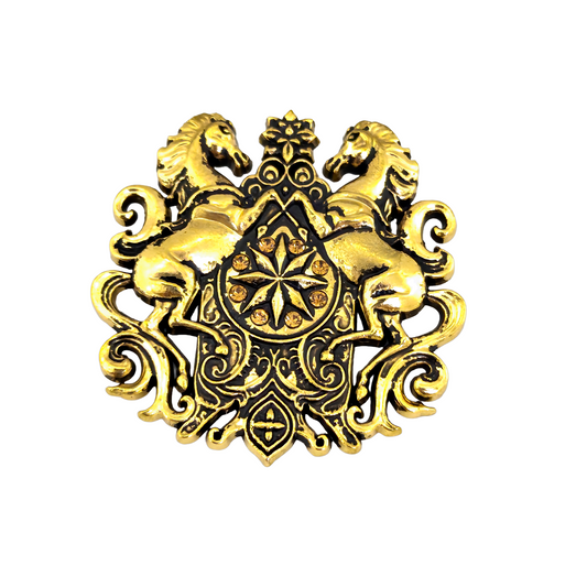Decorative gold emblem with two horses and intricate patterns on a white background