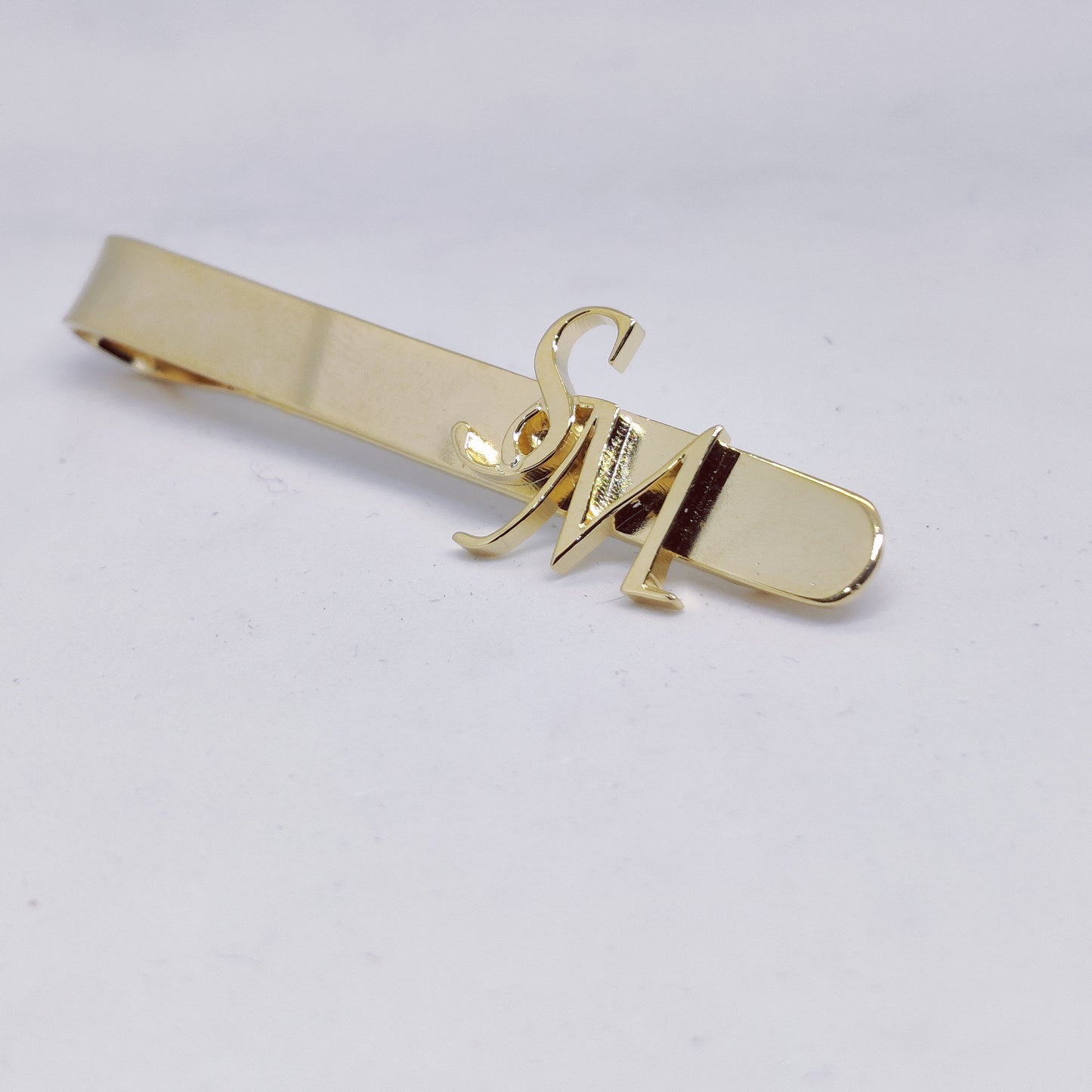 SM initial tieclip