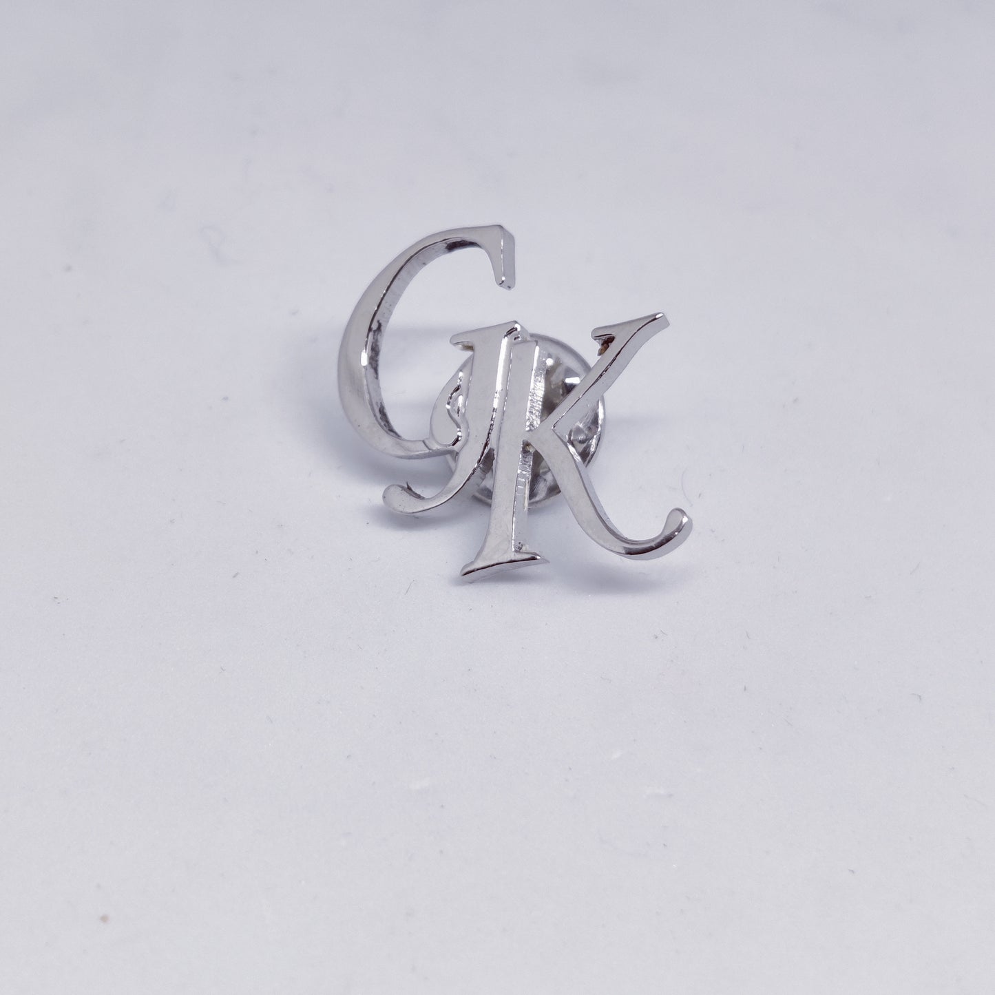 GK initial lapel pin