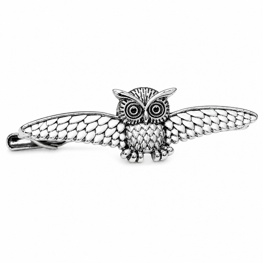 Silver owl tie clip a white background