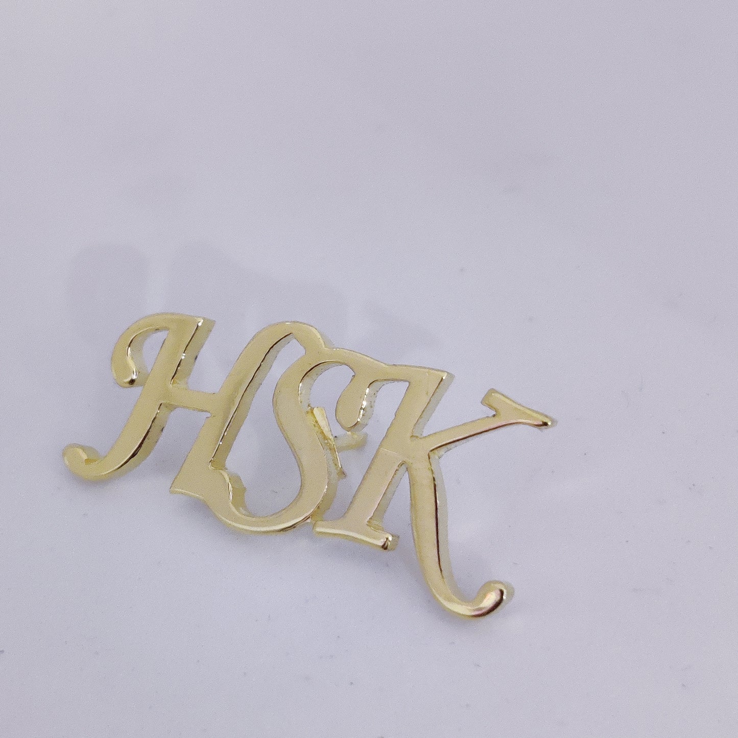 HSK Triple Initials lapel pin