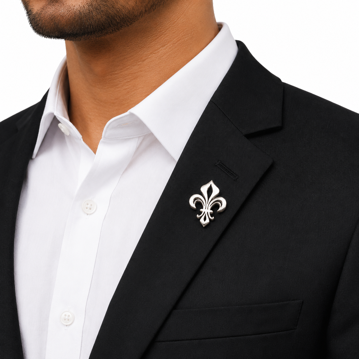 Black suit jacket with a white shirt lapel pin on a white background