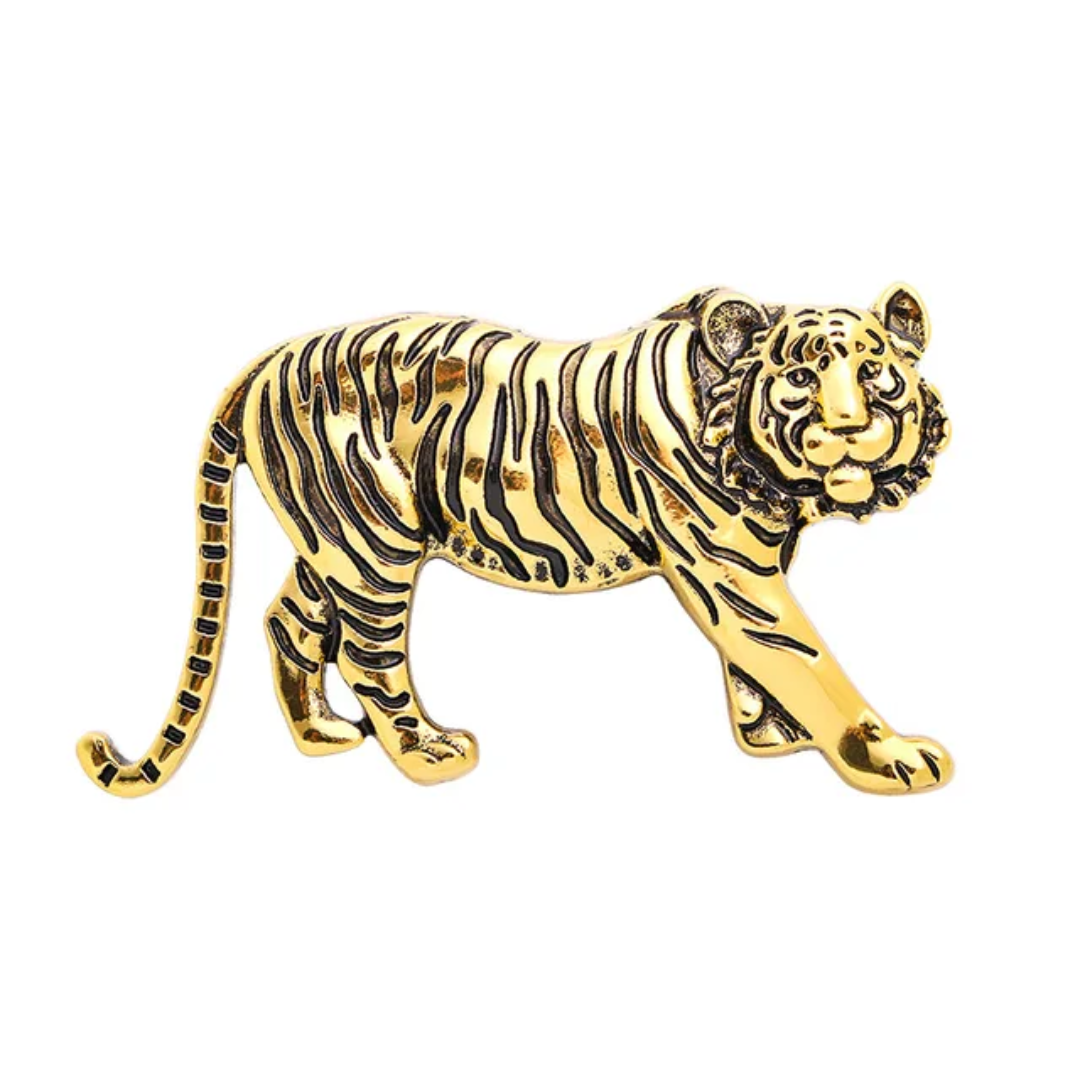 Gold tiger figurine on a white background