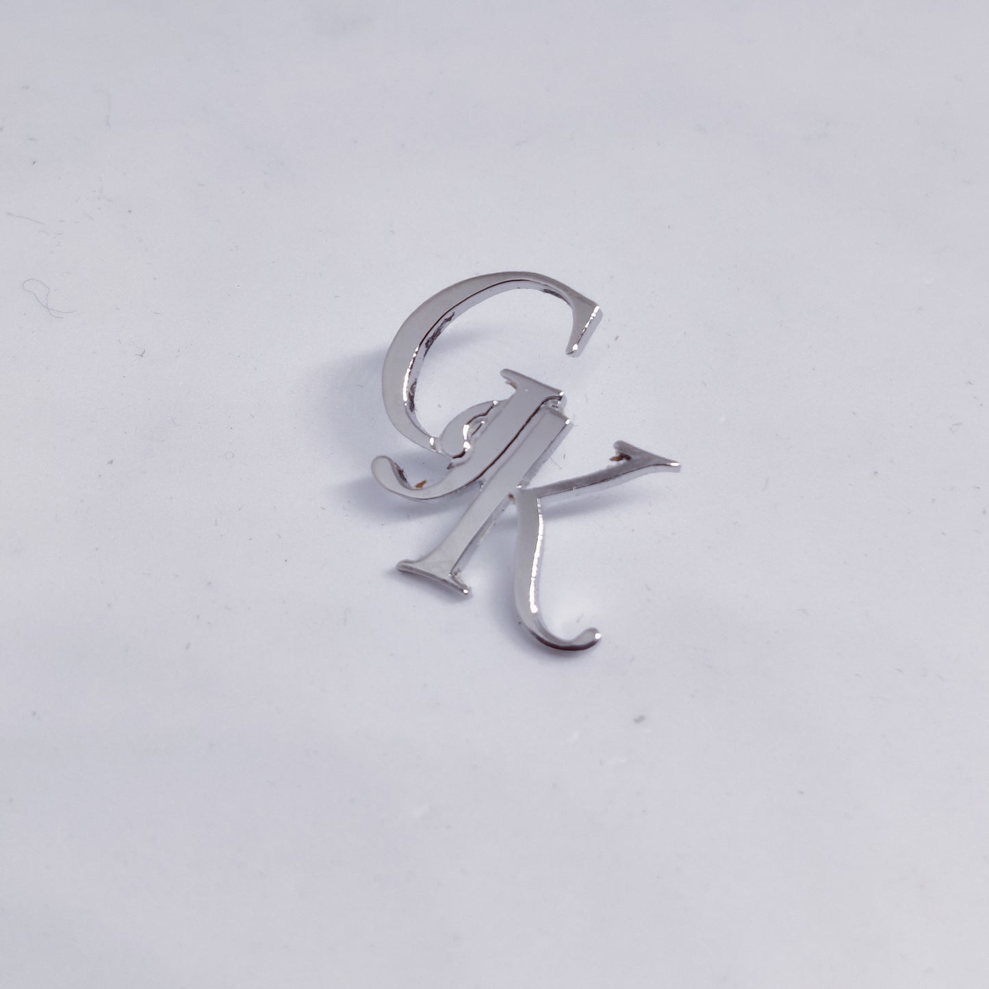 GK initial lapel pin